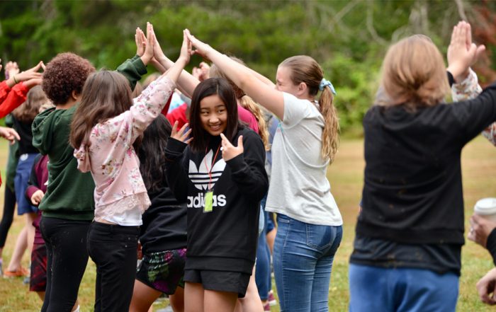 students participate in team building during middle school camp